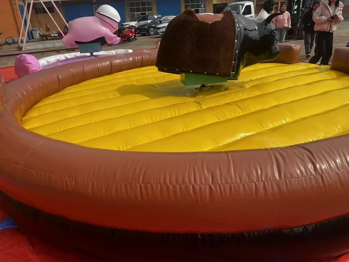 Long-hair shaggy mechanical bull in an inflatable ring