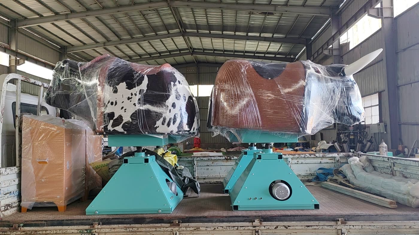 Two mechanical bulls loaded on a truck for delivery to port