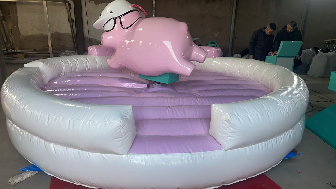 Pink kiddie rodeo pig ride with helmet and sunglasses